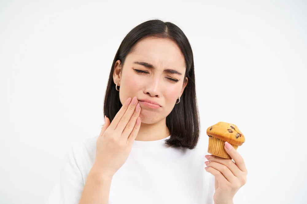 A patient avoiding chewing on the treated tooth after root canal treatment.