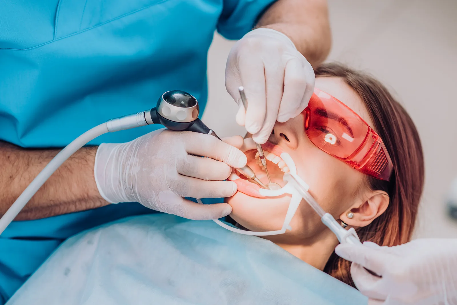 dentist-examining-patient-s-teeth-with-tools-and-g-2026-03-26-05-36-44-utc.jpg