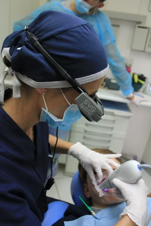 Dentist examining a patient's teeth during a dental check-up in Highton.