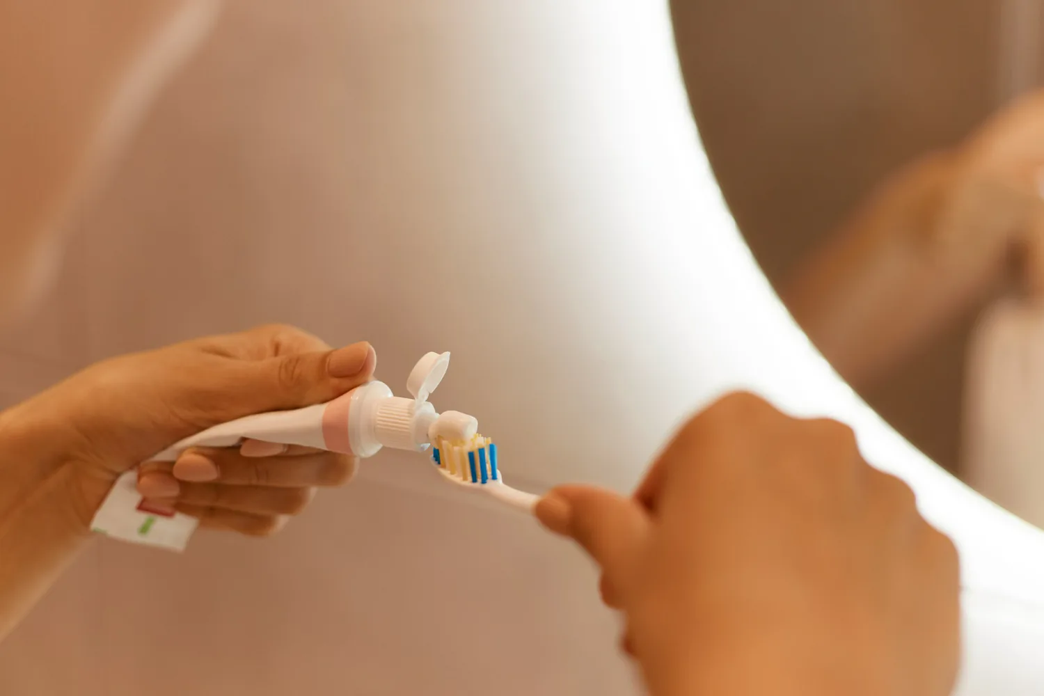 Patient using a desensitising toothpaste to reduce discomfort.
